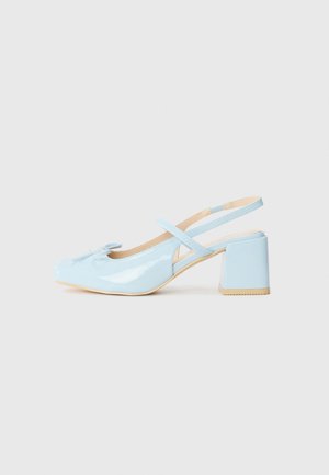 Patent leather slingback shoe in light blue, featuring a block heel, rounded toe, and a bow accent at the front.