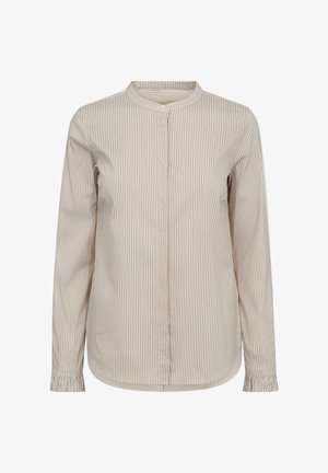 Juostelėta mygtukinė marškinėliai, kurių spalvos - smėlinė ir šviesiai ruda, su mandarinų tipo apykakle, ilgomis rankovėmis ir sutrauktomis rankogaliais. Švelni, lengva audinio tekstūra.