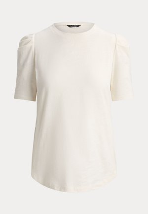 Hvit t-skjorte med korte ermer, rund hals, myk tekstur og lette puffede skuldre. Litt buet nederkant.