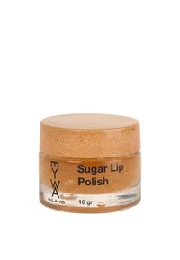 Barattolo di vetro trasparente di scrub labbra al zucchero, con un coperchio di sughero beige. L'etichetta mostra la scritta "Scrub Labbra al Zucchero" e "10 gr" in nero.