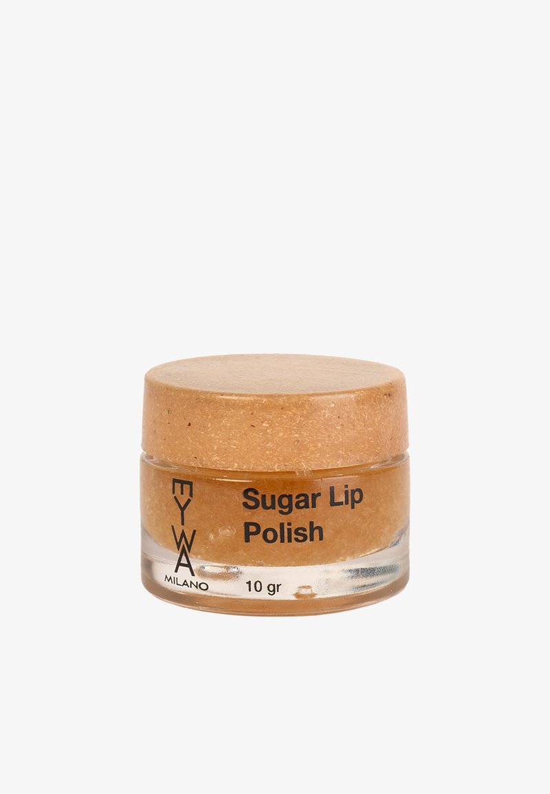 Barattolo di vetro trasparente di scrub labbra al zucchero, con un coperchio di sughero beige. L'etichetta mostra la scritta "Scrub Labbra al Zucchero" e "10 gr" in nero.