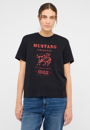 Black cotton t-shirt featuring a red vintage-style graphic with "MUSTANG ORIGINAL" and a horse design, with short sleeves and a relaxed fit.