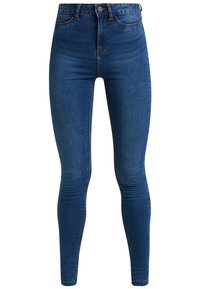 Jeans ajustados de mezclilla azul oscuro con cintura alta, que presentan un ligero desvanecimiento, diseño clásico de cinco bolsillos y detalles de costura.