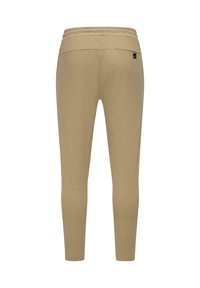 Feszes, bézs leggings textúrált anyagból, magas derékkal és egy kicsi, logóval díszített zsebbel a hátsó részen.