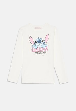 White long-sleeve shirt featuring a cartoon Stitch with pink ears and the text "OHANA MEANS FAMILY" in pink below. Soft cotton material.