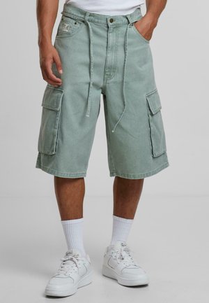 Light green cargo shorts with a relaxed fit, featuring multiple pockets, drawstring waist, and a cuffed hem. Made of denim fabric.