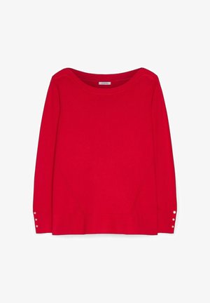 Maglione lungo rosso a maniche lunghe con scollatura tonda e tre piccoli bottoni bianchi su ciascun polsino.
