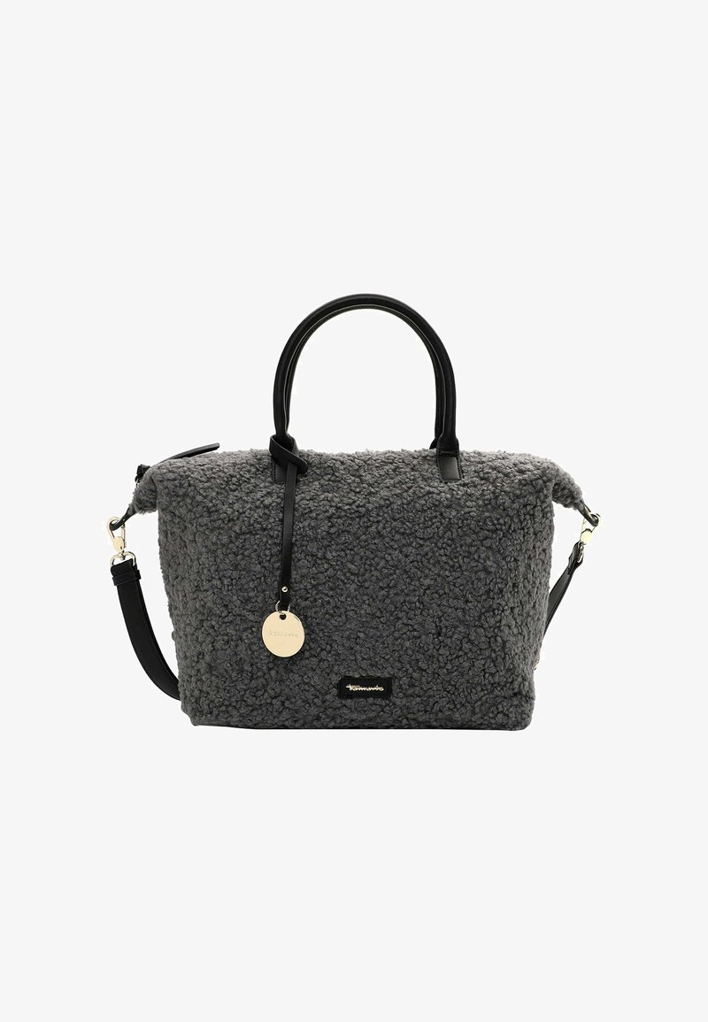 Hall hallikasflanellist käekott mustade nahast käepidemete ja reguleeritava rihmaga. Omab ümmargust metallist sildi ja tekstuurset pinda.