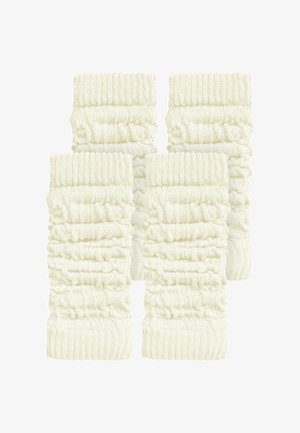 Vier cremefarbene, gerippte Beinwärmer aus Strickstoff mit einem strukturierten, gerafften Design und dicken, elastischen Bündchen oben.