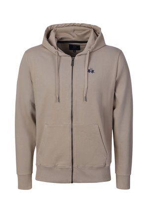 Beige hoodie met volledige ritssluiting, voorzakken, trekkoorden in de capuchon, geribde manchetten en zoom, en een klein donkerblauw geborduurd logo op de linkerborst.