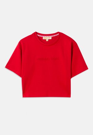 T-shirt curta vermelha feita de algodão, com decote redondo ribbed e logótipo em relevo "MICHAEL KORS" na parte da frente. Mangas curtas.