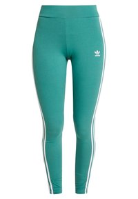 Teal Adidas leggings med hög midja, vita sidostråk längs benen och Adidas trefoil-logga på övre vänstra låret.