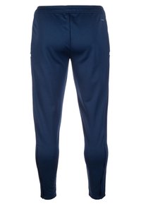 Marineblaue Sporttrackpants mit elastischem Bund und schmal zulaufendem Bein, ausgestattet mit kleinen Reißverschlüssen an den Knöcheln.