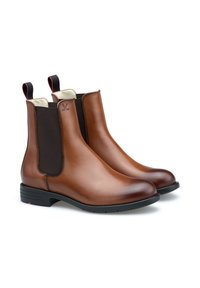 Stivaletti in pelle marrone con pannelli elastici neri sui lati, punta rotonda e tab di estrazione. Finitura liscia con logo discreto sul lato.