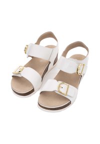 White sandal with two adjustable straps, gold buckles, cork wedge sole, and a textured footbed. Smooth upper material, open back design.