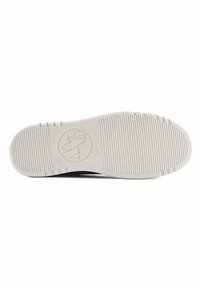White outsole with a textured ribbed pattern and circular logo embossed. The heel features a slight elevation, indicating a casual shoe design.