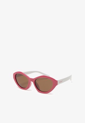 Occhiali da sole rosa con montatura ovale, lenti marroni e stanghette bianche, con il marchio "Kiddus" sulla stanghetta laterale.