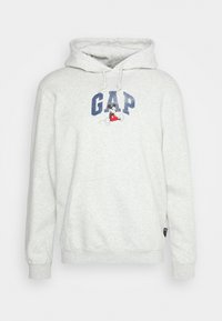 Felpa grigia chiara con cappuccio regolabile, con logo blu "GAP" e un grafico di un personaggio dei cartoni in rosso e nero. Tessuto morbido.