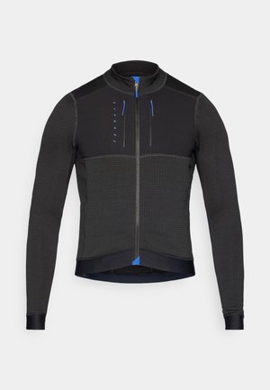 Svart zip-jacka med långa ärmar, texturerat tyg, kontrasterande blå accenter och en slim fit-design. Har en hög krage och säkra dragkedjor.