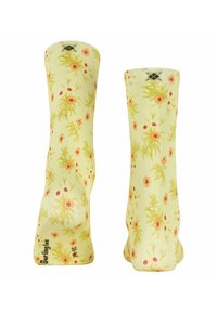 Kniestrümpfe in einem hellgelben Farbton mit floralen Mustern, die pinke und grüne Akzente aufweisen. Hergestellt aus weichem Stoff, mit einem gerippten Bund.