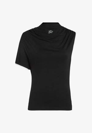 Musta, lyhythihainen paita, jossa on laskostettu pääntie ja yksi hiha, valmistettu sileästä kankaasta. Takana on pieni logo kauluksessa.