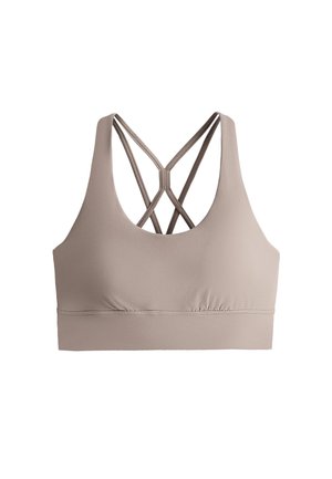 Világos barna sportmelltartó dupla keresztpántokkal a háton és széles alsó pánttal a tartásért, fehér háttéren bemutatva.