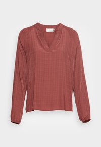 Blusa a maniche lunghe color ruggine con scollatura a V, tessuto testurizzato e polsini arricciati. Presenta un delicato motivo a quadretti su tutta la superficie.