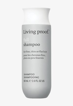 Grijze fles met Living Proof shampoo, met een taps toelopende vorm en witte dop; gelabeld voor fijn, dun of plat haar; 60 ml.
