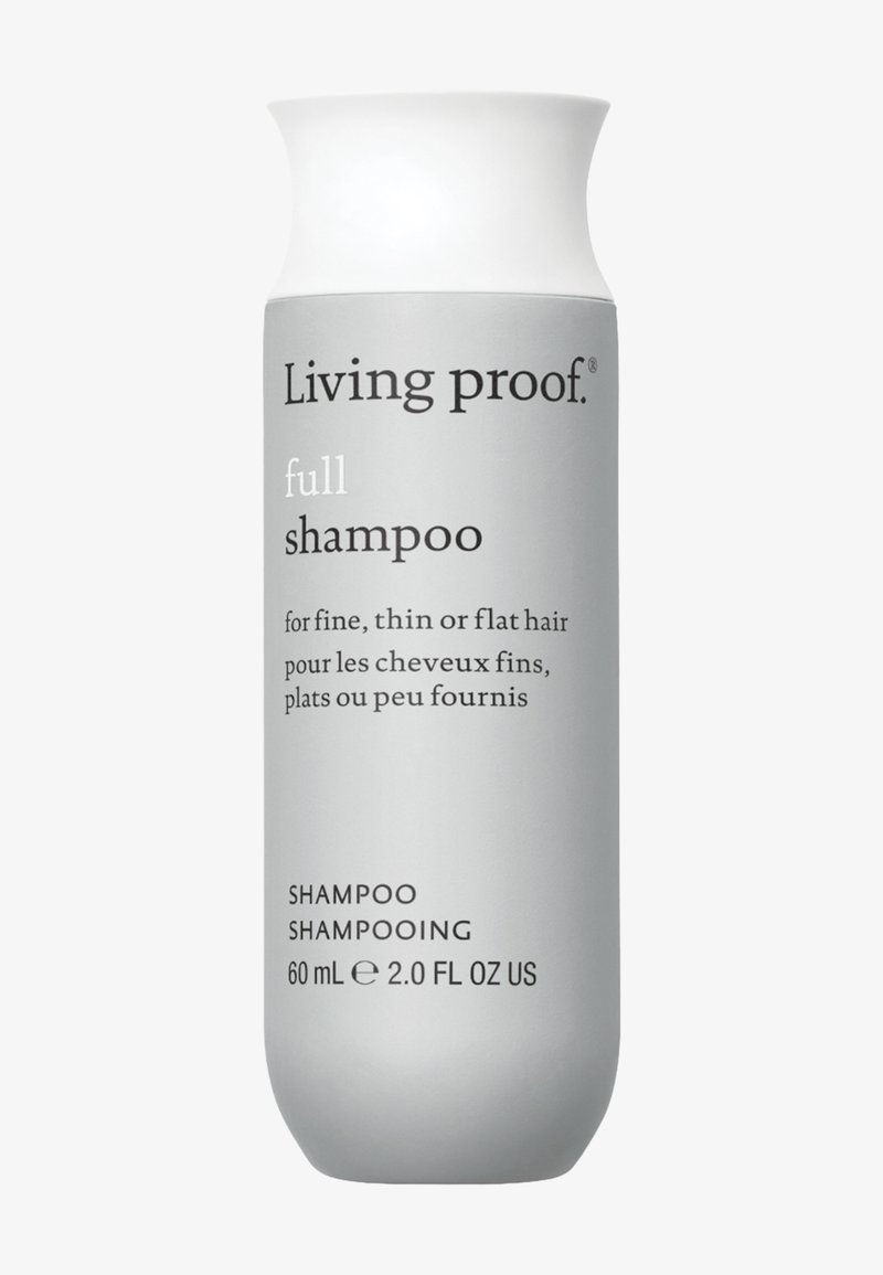Grijze fles met Living Proof shampoo, met een taps toelopende vorm en witte dop; gelabeld voor fijn, dun of plat haar; 60 ml.