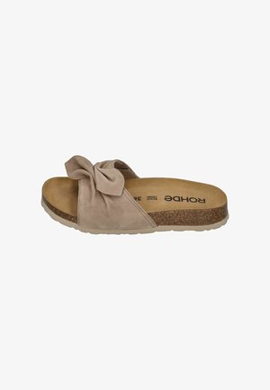 Beige suede slide sandal with a large fabric bow on top, cork midsole, and cushioned footbed labeled "Rohde."