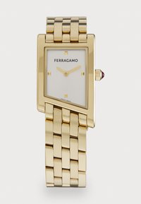 Sélectionné, gold-coloured