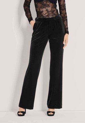 WEITE MIT ELASTISCHEM BUND - Trousers - black