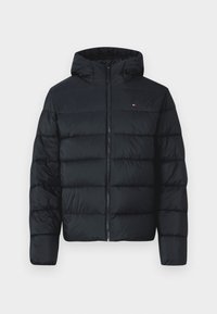 Black puffer jacket with a hood, featuring quilted sections, full-zip front, and a small logo on the upper left. Soft, textured fabric.