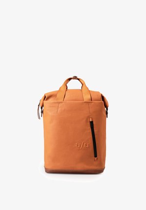 Orange roll-top backpack with a smooth texture, featuring a side zipper pocket and brown leather base. Logo embossed on the front.