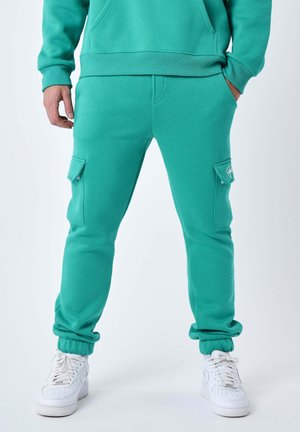 BAS DE STYLE SIGNATURE - Pantalones cargo - vert électrique
