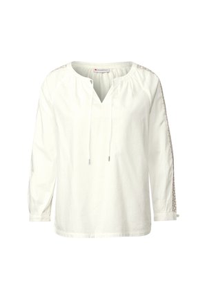 Witte lange mouw shirt met een V-hals, geplooide schouders, trekkoordhalslijn en intricatelace details langs de mouwen.