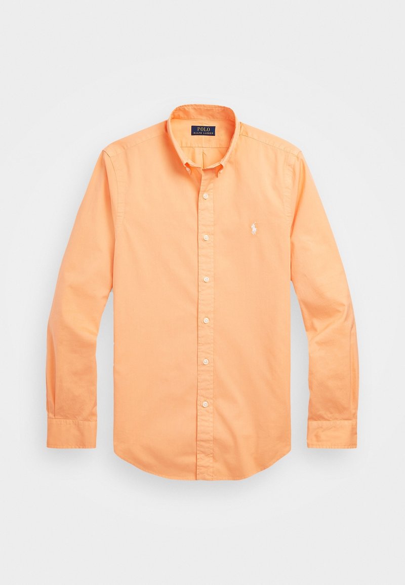 Orange knäppskjorta i bomullstyg, med spetsig krage, långa ärmar och en liten broderad logotyp på bröstet.