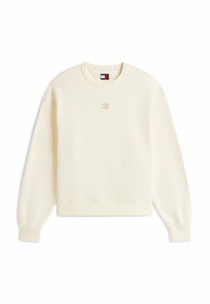 Cremefarbenes Sweatshirt mit langen Ärmeln und Rundhalsausschnitt, gerippten Bündchen und Saum, kleinem zentralem Logo-Patch und markentypischem Nackenetikett.