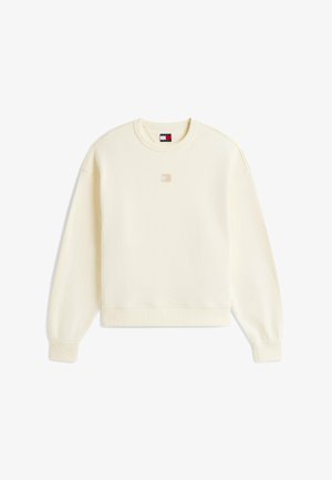 Cremefarbenes Sweatshirt mit langen Ärmeln und Rundhalsausschnitt, gerippten Bündchen und Saum, kleinem zentralem Logo-Patch und markentypischem Nackenetikett.
