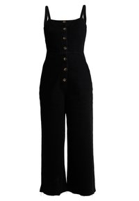 Svart linnjumpers med justerbara axelband, knappar framtill, vida ben och råa fållar. Slät textur med en figurnära midja.