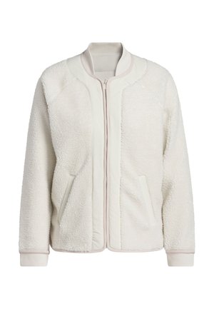 Krämfärgad fuskpälsjacka med en slät frampanel, ribbade muddar och två sidofickor. Har en hel dragkedja och rund halsringning.