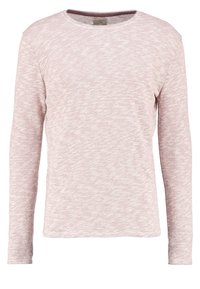 Ljust rosa långärmad tröja gjord av ett mjukt, texturerat tyg med en avslappnad passform och rundad halsringning. Subtil melerad mönstring genom hela tröjan.