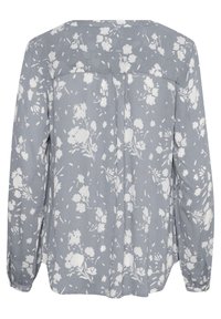Blusa a maniche lunghe in tessuto grigio chiaro con motivo floreale bianco, caratterizzata da un taglio dritto, retro plissettato e polsini con bottoni.