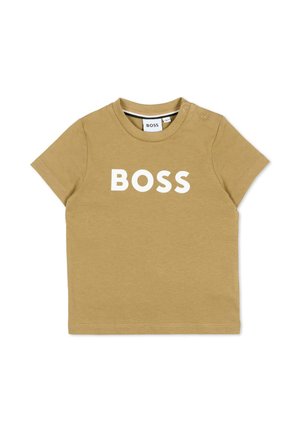 Maglietta beige per bambino piccolo a maniche corte con scritta bianca "BOSS", collo rotondo e due bottoni a pressione sulla spalla.