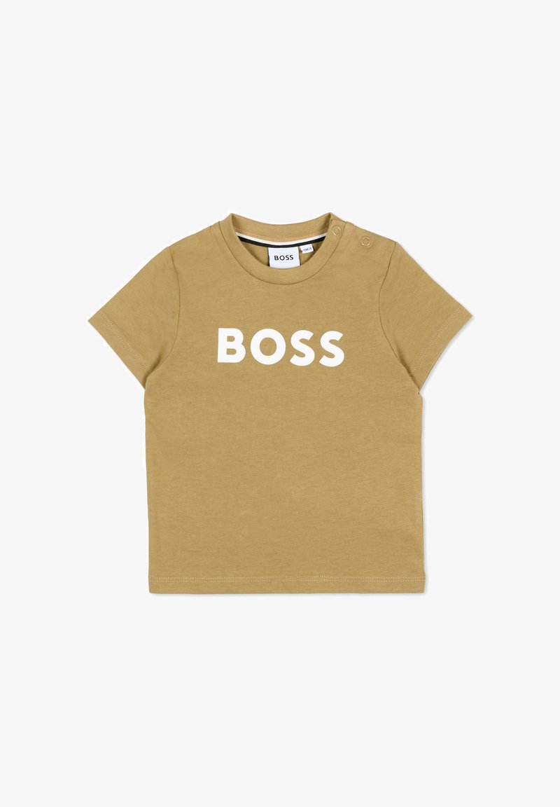 T-shirt beige pour tout-petit à manches courtes avec texte blanc "BOSS", col rond et deux boutons-pression aux épaules.
