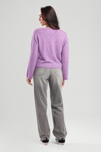 Lavender knit sweater with long sleeves, cropped fit, and a soft texture, paired with light gray wide-leg jeans and black sneakers.