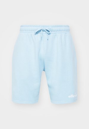 Lyseblå bomullsshorts med elastisk midjebånd og snøring. Har en hvit logo nederst til venstre. Glatt tekstur.