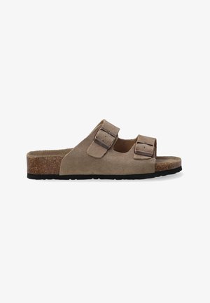 Brown suede slide sandals with two adjustable buckles, cork footbed, and a textured black rubber sole. Classic open-toe design.