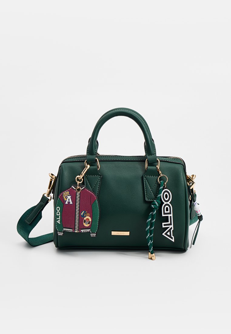 Borsa strutturata verde in ecopelle, con doppi manici superiori, una tracolla rimovibile e un charm decorativo con cerniera e accenti colorati.