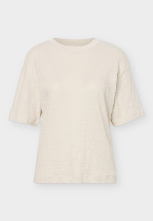 T-shirt crème à manches courtes avec col rond, coupe décontractée et texture subtile sur un fond clair uni.